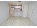 Well-lit open floor plan with ceramic tile, blending living and kitchen areas seamlessly at 1400 Gandy N Blvd # 1705, St Petersburg, FL 33702