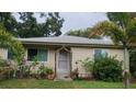 Welcoming front entrance adorned with floral accents and potted plants at 1735 Cleveland St, Clearwater, FL 33755