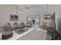 Modern living room with vaulted ceilings, neutral colors, and contemporary furnishings at 2252 New Bedford Dr, Sun City Center, FL 33573