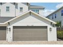 Close up of home garage with brick driveway and black iron fence at 307 S Arrawana Ave # 100, Tampa, FL 33609