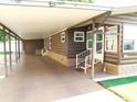 Spacious covered parking area leading to the home's entrance with secure double door access at 36901 Tara Ave, Zephyrhills, FL 33542