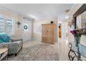 Bright entryway with a decorative rug, accent furniture, and plenty of natural light from the window at 4191 Maple Ne St, St Petersburg, FL 33703