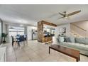 Inviting living space featuring a seamless flow between the dining area, kitchen, and living room, perfect for entertaining at 4710 Travertine Dr, Tampa, FL 33615