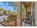 Close-up of the porch area showing a small table and chairs at 4734 67Th N Ave, Pinellas Park, FL 33781