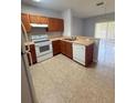Efficient kitchen features modern appliances, tile floors and ample counterspace at 6025 Osprey Lake Cir, Riverview, FL 33578