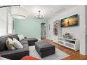 Cozy living room with hardwood floors and ample natural light at 1003 W Indiana Ave, Tampa, FL 33603