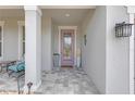 Inviting front porch featuring neutral decor and tiled flooring at 11684 Brighton Knoll Loop, Riverview, FL 33579