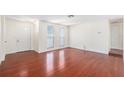 Spacious living room featuring hardwood floors, neutral walls, and windows for natural light at 12019 106Th Ct, Largo, FL 33778