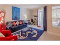 Nautical themed living room with blue sofa and anchor rug at 1230 S Missouri Ave # 704, Clearwater, FL 33756