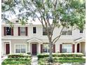 View of the townhouse exterior, showcasing the well-maintained landscaping and architectural details at 15922 Fishhawk Creek Ln, Lithia, FL 33547