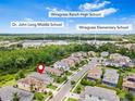 Aerial view showing the home's location in proximity to nearby schools and neighborhood at 30410 Ceasar Park Dr, Wesley Chapel, FL 33543