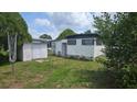 This home has a large backyard with shed at 37229 Lois Ave, Zephyrhills, FL 33542