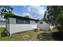 Exterior home with back yard view at 37229 Lois Ave, Zephyrhills, FL 33542