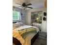 Comfortable bedroom offers a ceiling fan, natural light, and ample storage space at 6741 4Th Ave N, St Petersburg, FL 33710