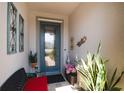 Cozy front porch featuring a decorative glass door and neutral wall decor at 7912 Yale Harbor Dr, Wesley Chapel, FL 33545