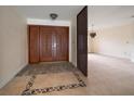 Welcoming foyer featuring decorative tile flooring and an impressive double-door entry at 14175 Feather Sound Dr, Clearwater, FL 33762
