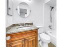 Bathroom featuring a vanity with granite countertop and a tub-shower combination at 15604 Deerglen Dr, Tampa, FL 33624