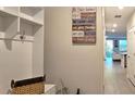 Hallway features convenient coat rack, storage, and access to the living area at 17015 Coral Key Dr, Nokomis, FL 34275