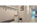 Hallway boasts coat rack, storage, and easy access to the rest of the home at 17015 Coral Key Dr, Nokomis, FL 34275