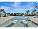 Inviting pool with relaxing sun loungers in the shallow end, perfect for enjoying waterfront views at 1901 Kansas Ne Ave, St Petersburg, FL 33703