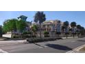 Street view of new townhome construction showing covered parking, balconies and rooftop patios at 20 Outlook Way # 10, Dunedin, FL 34698