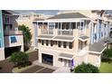 New townhome construction showing covered parking, balconies and rooftop patios at 20 Outlook Way # 10, Dunedin, FL 34698
