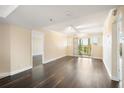 Bright living room with hardwood floors, slider doors and neutral walls at 3211 W Swann Ave # 605, Tampa, FL 33609
