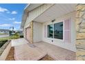 Home exterior featuring stone accents, tidy landscaping, and a quaint, welcoming facade at 339 Club Manor Dr, Sun City Center, FL 33573