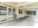 Spacious carport featuring a screened-in porch and convenient access to the home at 3542 Castle Dr, Zephyrhills, FL 33540