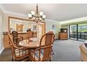 Light and bright condo with open floor plan dining room and sliding glass doors to patio at 36750 Us 19 N # 15309, Palm Harbor, FL 34684