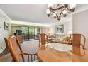 Comfortable living room with sliding glass doors leading to a private outdoor patio at 36750 Us 19 N # 15309, Palm Harbor, FL 34684