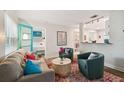 Comfortable living room with modern furniture, a decorative rug, and an open doorway to the bedroom at 4324 S Clark Ave, Tampa, FL 33611