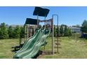 A playground featuring a green slide and metal steps at 4617 Ashburn Square Dr, Tampa, FL 33610