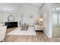 Bright living room boasts high ceilings, wood floors, and stylish furnishings at 4921 Wessex Way, Land O Lakes, FL 34638