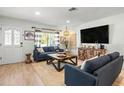 Bright living room with stylish decor, comfortable seating, and ample natural light at 501 Janice Pl, Indian Rocks Beach, FL 33785