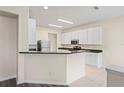 Kitchen featuring granite countertops, stainless steel appliances, and tiled flooring at 7249 Bridgeview Dr, Wesley Chapel, FL 33545