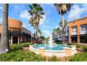 Vibrant community center with a fountain and palm trees, surrounded by shops and restaurants, offering a lively atmosphere at 10219 Millport Dr, Tampa, FL 33626