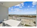 A private outdoor balcony offers panoramic views of the pristine beach and sparkling ocean at 11500 Gulf Blvd # 513, Treasure Island, FL 33706