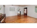 Bright living room featuring hardwood floors and an open floor plan, leading to the kitchen at 3321 14Th N St, St Petersburg, FL 33704