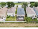Aerial view of the home showcasing the screened in patio and fenced backyard at 3351 Lintower Dr, Land O Lakes, FL 34638