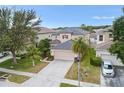 Two-story home with a well-manicured lawn, landscaping and a two car garage in a neighborhood at 3351 Lintower Dr, Land O Lakes, FL 34638