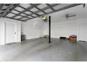 Garage includes ample space for parking, extra storage, and a convenient utility access door at 501 Knights Run Ave # 5103, Tampa, FL 33602