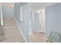 Light-filled hallway featuring modern lighting and light colored floors at 501 Knights Run Ave # 5103, Tampa, FL 33602