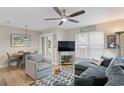 Relaxing living room featuring a comfortable sofa and decor with an adjacent dining area at 607 S Albany Ave # 1, Tampa, FL 33606