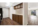 Kitchen with wood cabinets and hardwood-style flooring at 8630 Cattail Dr # 8630, Temple Terrace, FL 33637