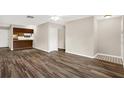 Open-concept living room with stylish flooring and neutral paint at 8630 Cattail Dr # 8630, Temple Terrace, FL 33637