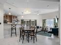 Open living space with dining area, kitchen bar, and comfortable seating, perfect for modern living at 1010 Central Ave # 227, St Petersburg, FL 33705