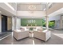 Inviting lobby area with comfortable seating, modern lighting, and lush green accents, creating a welcoming atmosphere at 1010 Central Ave # 227, St Petersburg, FL 33705