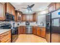 A well-equipped kitchen with stainless steel appliances and wooden cabinets at 10954 96Th St, Largo, FL 33773