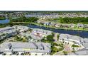 Stunning aerial view of the property showcasing its prime waterfront location on the canal with neighborhood view at 110 Aberdeen Pond Dr, Apollo Beach, FL 33572